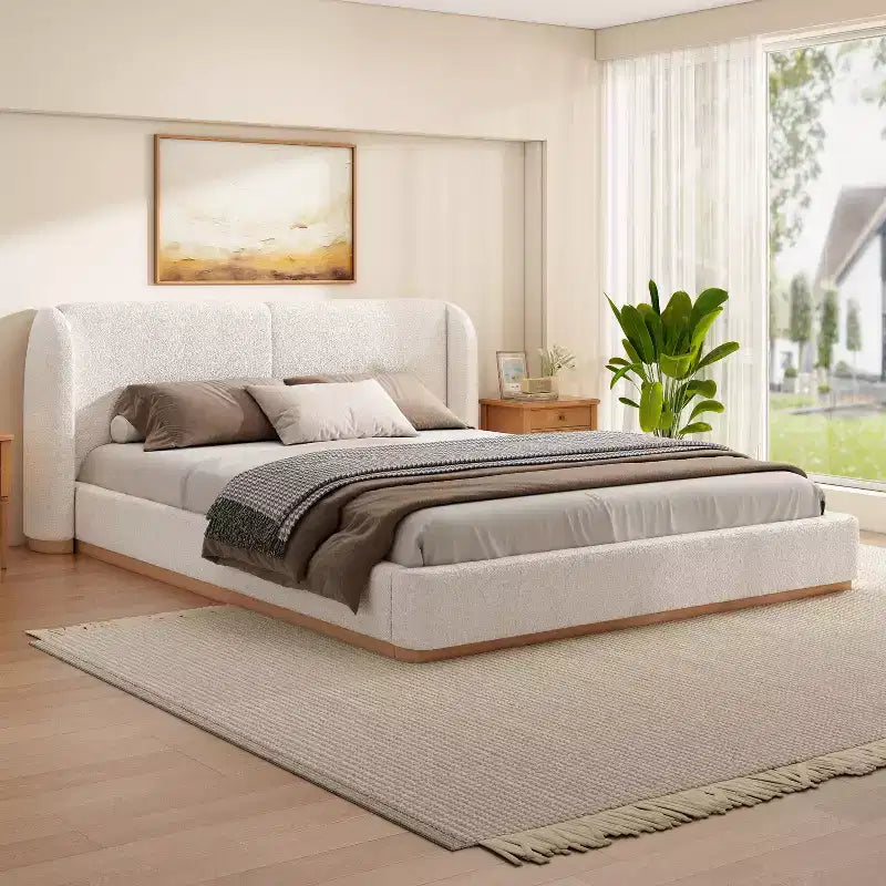 Base de cama con respaldo de ala tapizada en bouclé moderno