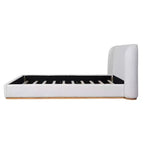 Base de cama con respaldo de ala tapizada en bouclé moderno