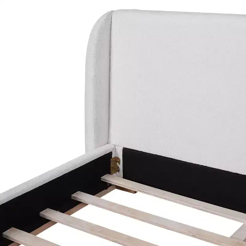 Base de cama con respaldo de ala tapizada en bouclé moderno