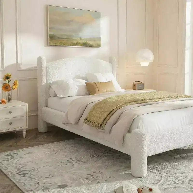 Base de cama tapizada con plataforma, cabecero redondo y patas cilíndricas